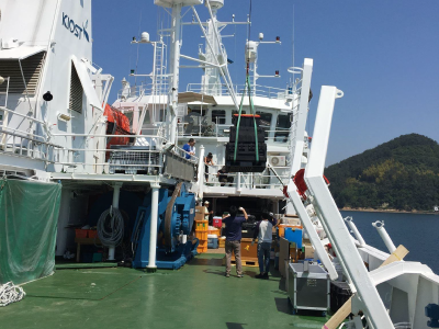 Containers are carefully hoisted on board the research vessel. Credit: Joaquin Goes (Columbia University)