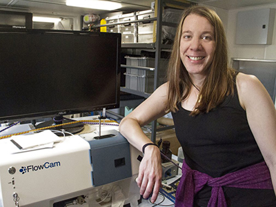 Biological Oceanographer Aimee Neely uses a FlowCam to study particles suspended in seawater. The FlowCam combines the functionality of an imaging flow cytometer and a microscope in a single, powerful tool.  Credit: Schmidt Ocean Institute/Monica Naranjo Gonzalez