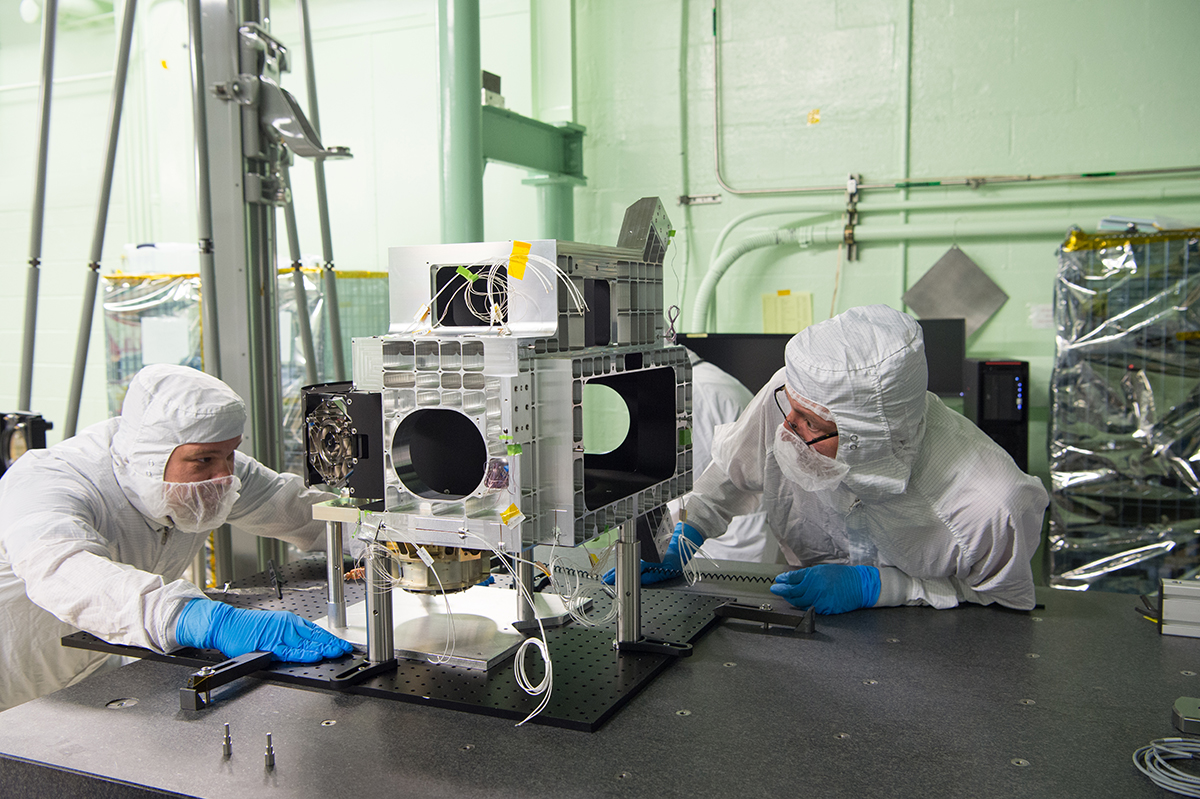 Installation of the ETU Rotating Telescope mechanism into the main optical bench structure.
