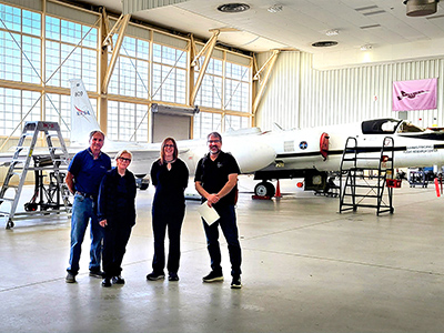 Members of the PACE-PAX team had a site visit to Edwards in preparation for the upcoming deployment.  L to R: Jeff Nelms (AFRC), Judy Alfter (ESPO), Sommer Nicholas (ESPO), Kirk Knobelspiesse (GSFC).  The ER-2 is in the background of B4802.