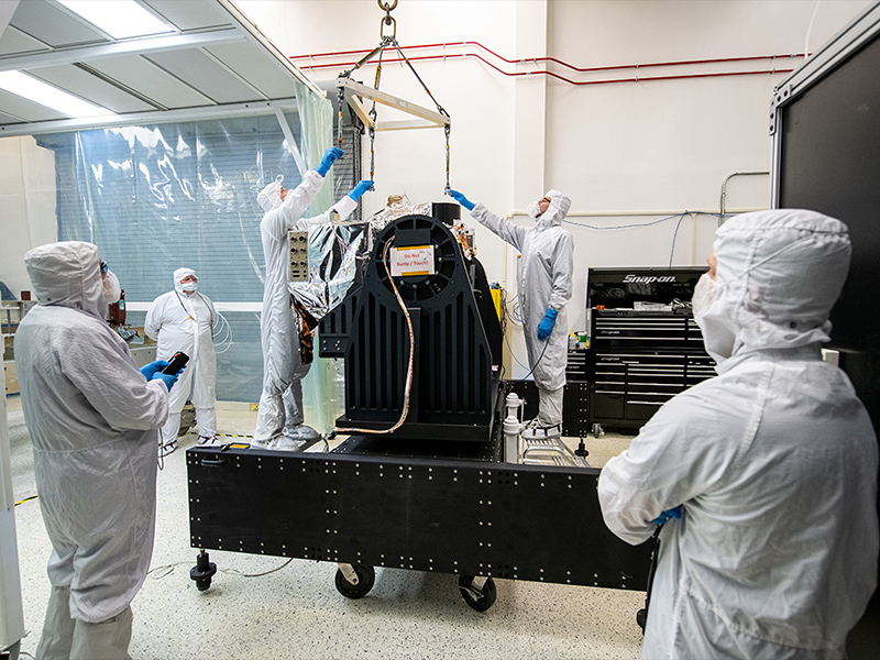 NASA engineers prepare for crane lifting of the OCI ETU.
