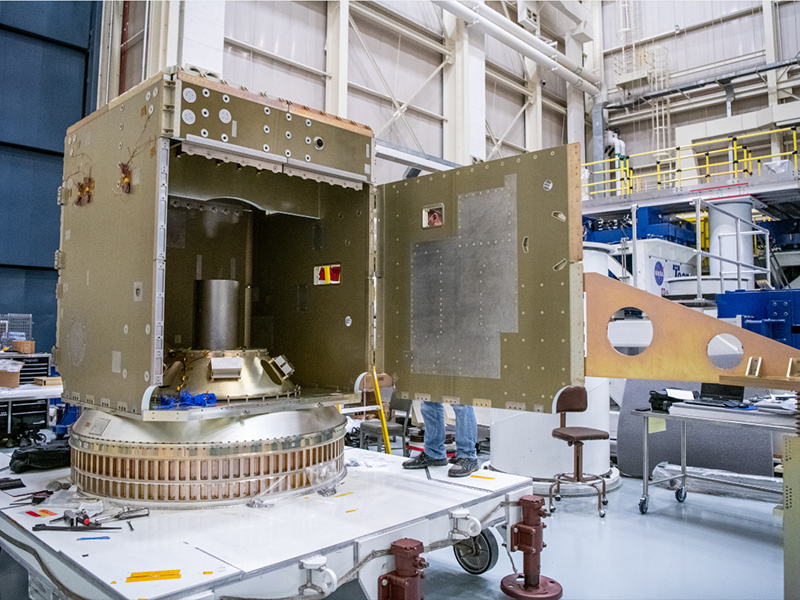 Assembling the structure and installing mass simulators and strength test fixtures 