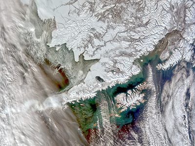 Alaska has thousands of kilometers of shorelines and coastal ecosystems. This image captures just a portion of the coast, including glimpses of the Gulf of Alaska, Bering Sea, and Chukchi Sea. Credit: NASA