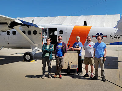 Cecile Carlson and Adam Ahern (NOAA CS, LiNeph), Dennis Hamaker (NPS), Luke Ziemba and Michael Shook (NASA LaRC, LARGE) after a electronics check of the Navy Postgraduate School (NPS) CIRPAS Twin Otter in Marina, CA.