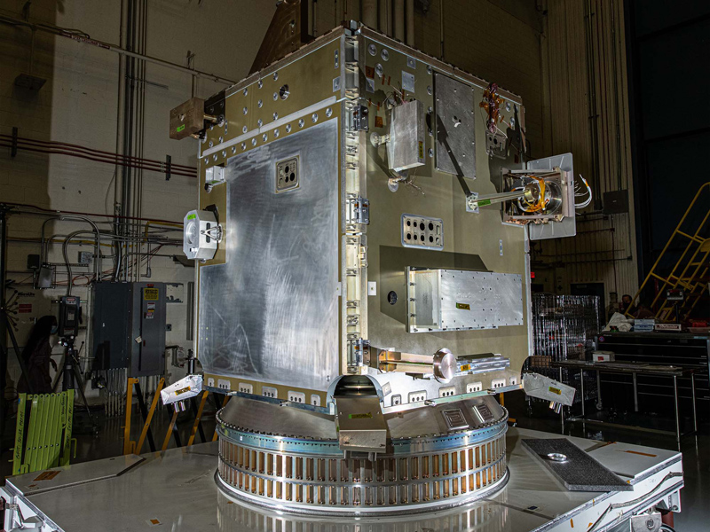 PACE spacecraft structure with mass simulators and tilt platform and solar array strength test fixtures.