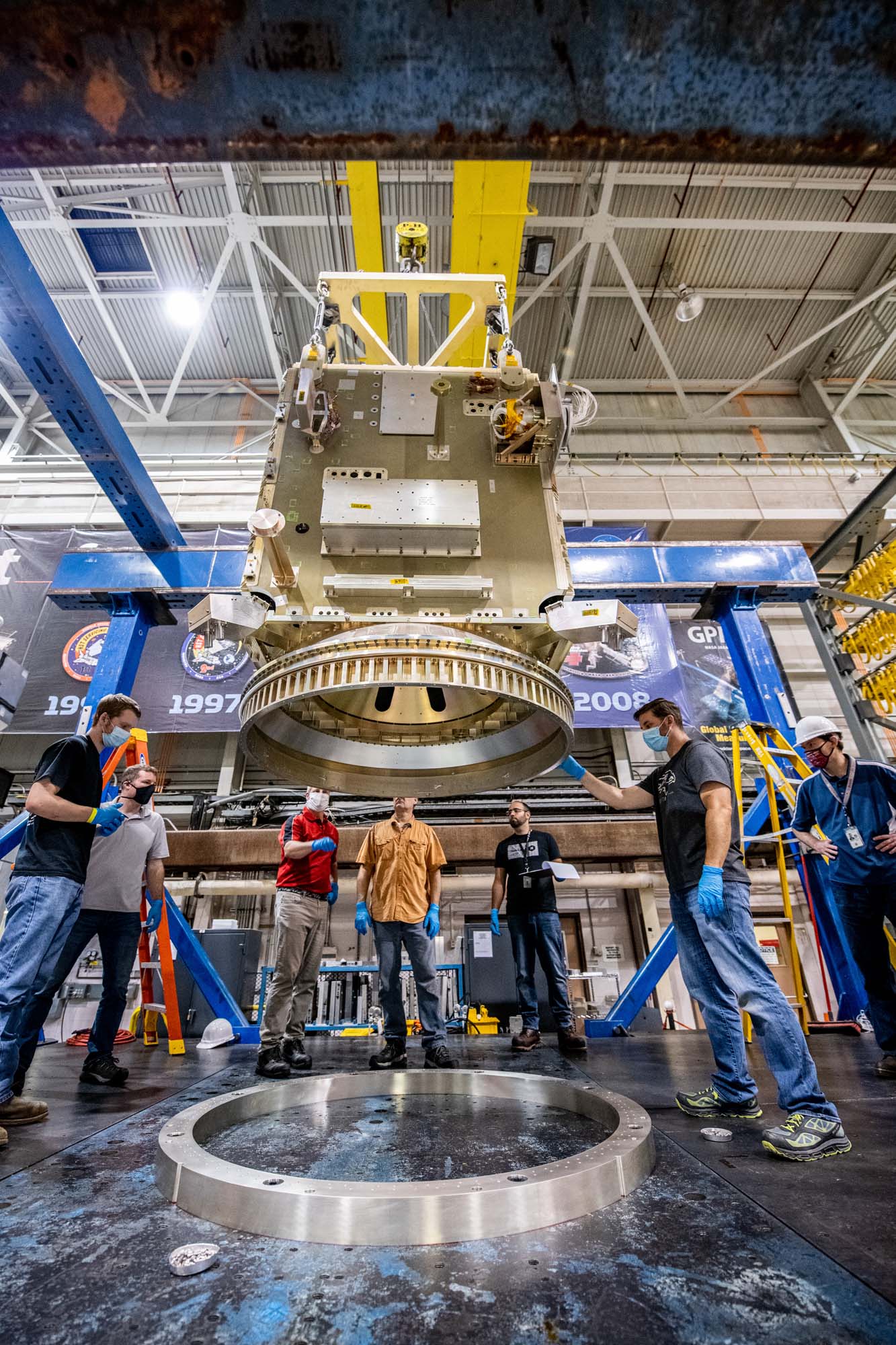 Lift of PACE spacecraft into the testing modal facility.