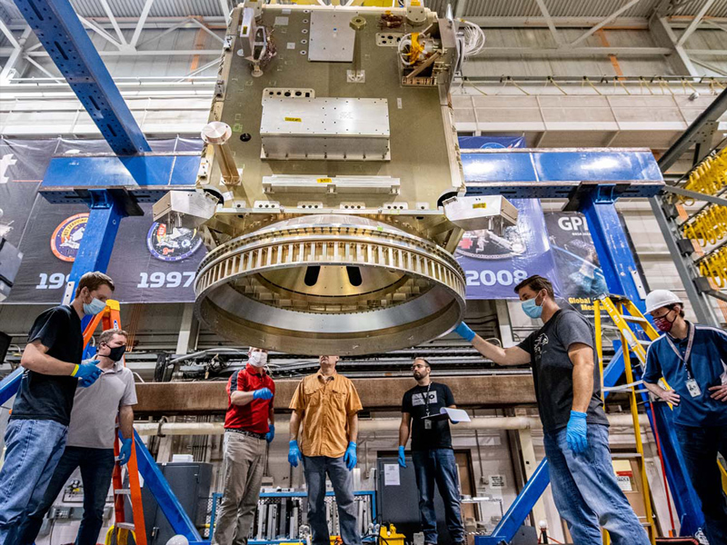 Lift of PACE spacecraft into the testing modal facility.