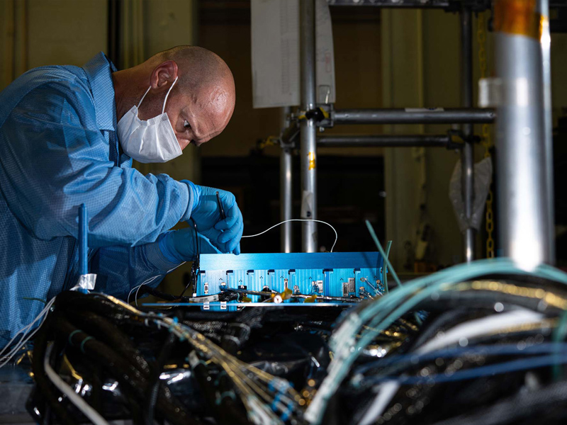 Inspecting attitude control electronics box housekeeping telemetry for fluctuations registered during random vibration testing.