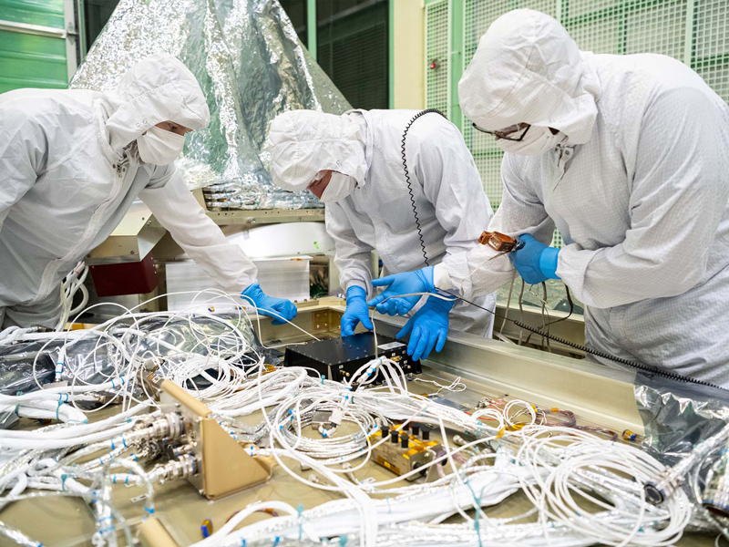 Installing GPS receiver box to a PACE spacecraft panel (-Z).