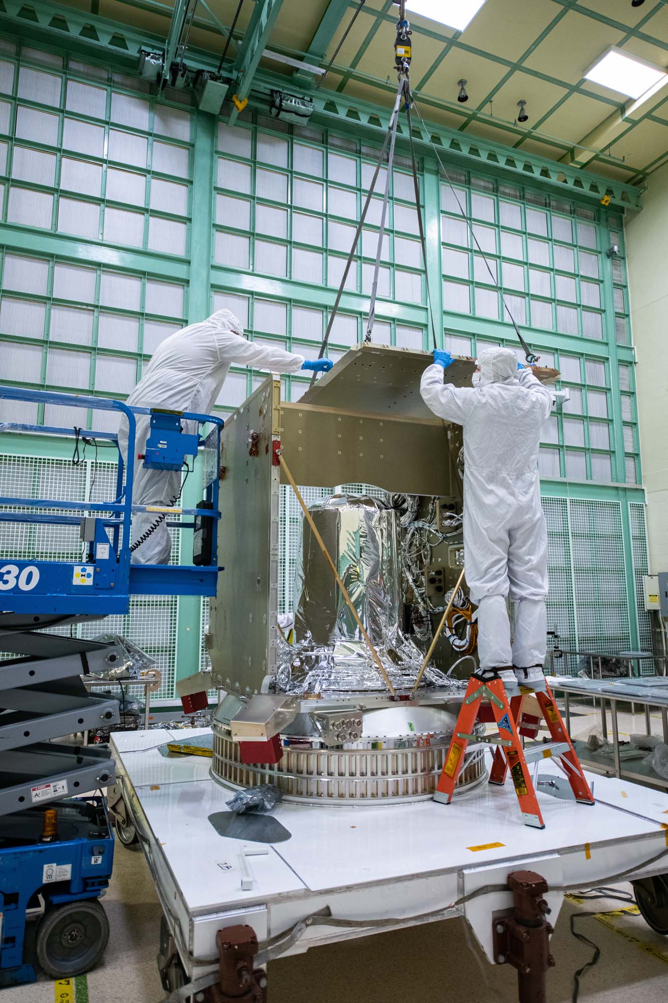 Installing the top of the PACE spacecraft bus structure.