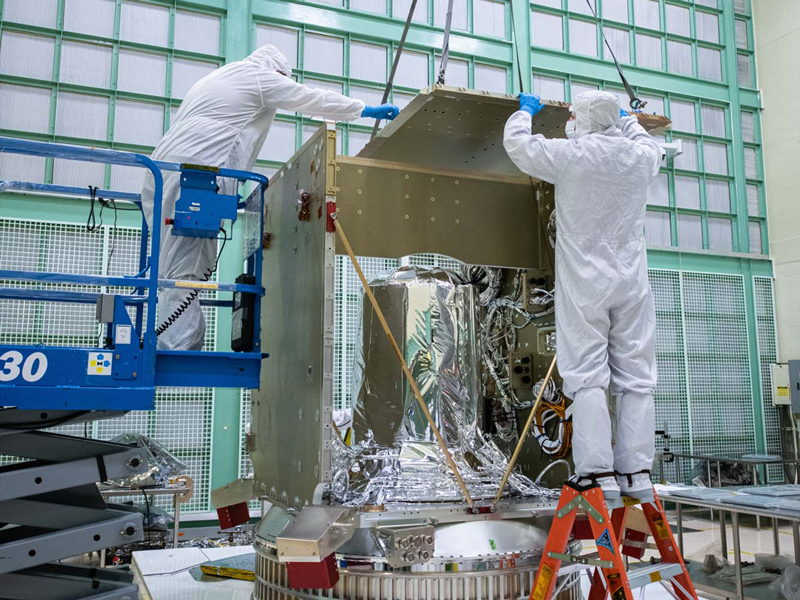 Installing the top of the PACE spacecraft bus structure.