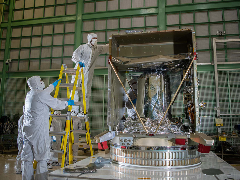 Checking the top of the PACE spacecraft bus structure.