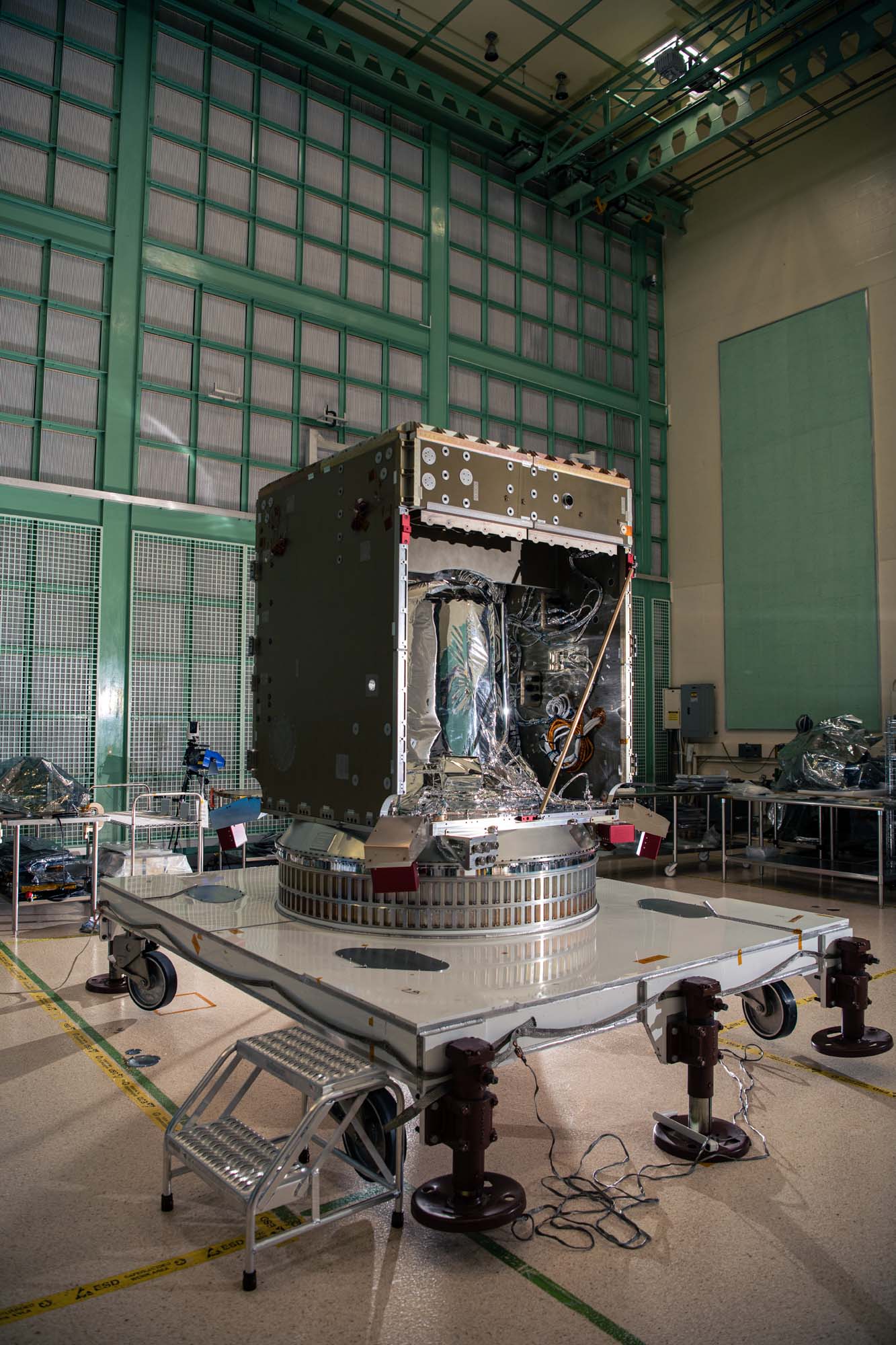 Checking the top of the PACE spacecraft bus structure.