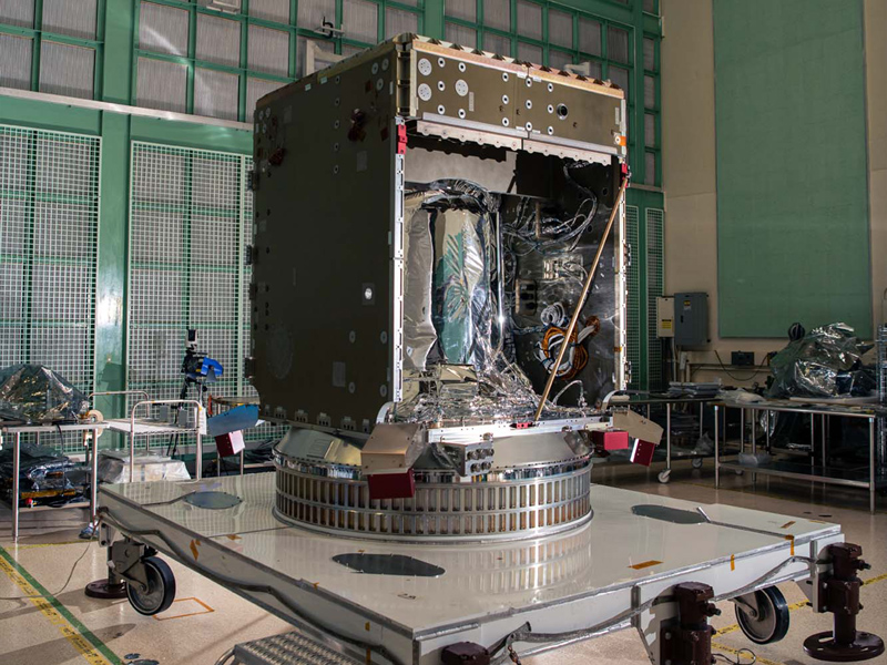 Checking the top of the PACE spacecraft bus structure.