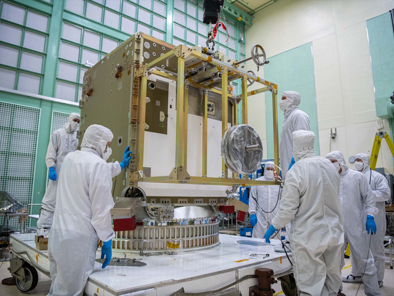 Assembling PACE spacecraft bus structure.