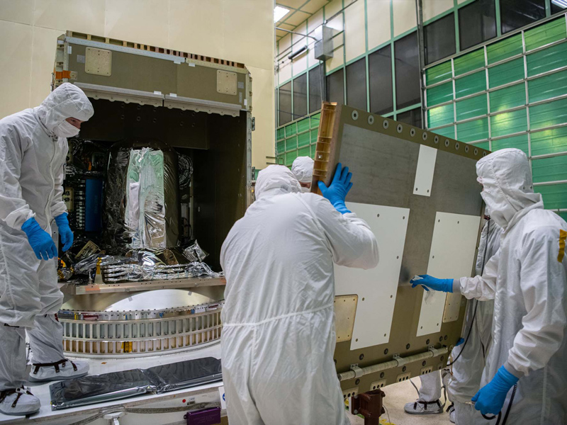 Panel (-Y) being installed on the spacecraft structure.