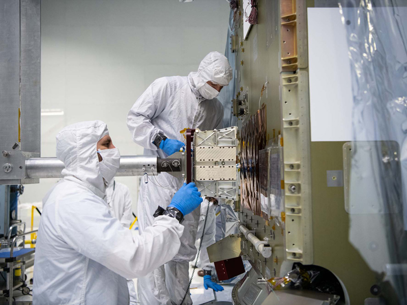 Installing qual battery on flight spacecraft bus.