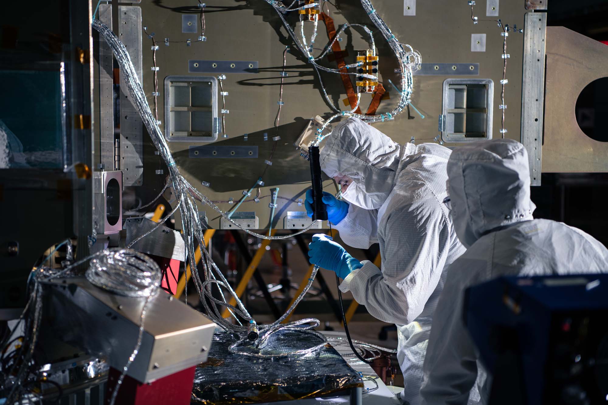 Performing component functional testing on the PACE spacecraft.