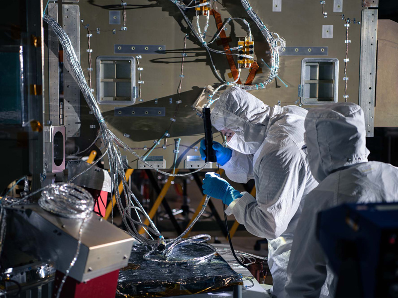 Performing component functional testing on the PACE spacecraft.