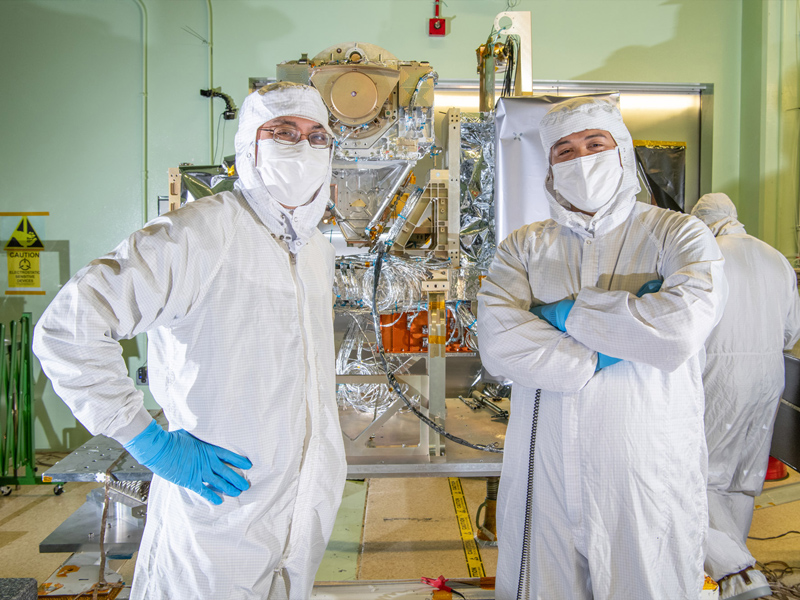 Mechanical Engineer Paul Dizon and Mechanical Technician Daniel Dizon with the Ocean Color Instrument. Credit: Stover, Desiree
