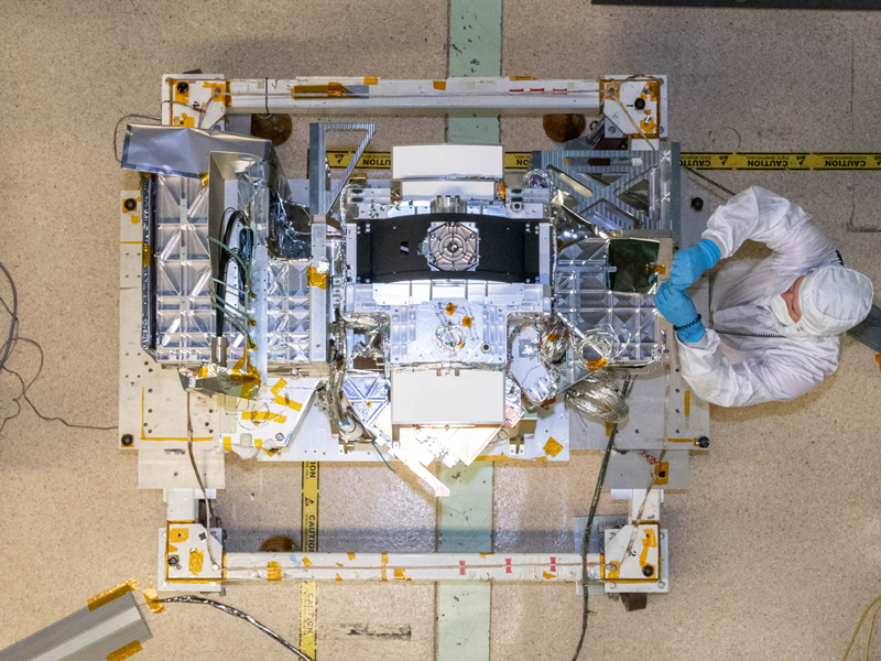 Mechanical Technician, John Poulsen, installs flight hardware during the Ocean Color Instrument post Optical Module (OM) integration to the Flight Instrument Deck Structure (IDS). Credit: Mellos, Katherine