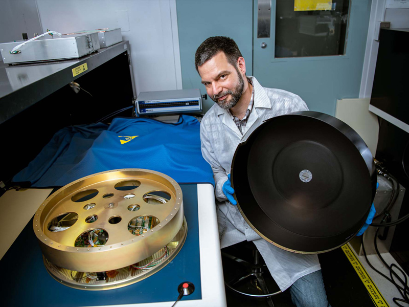Carlos Duran-Aviles with the PACE reaction wheel assembly.