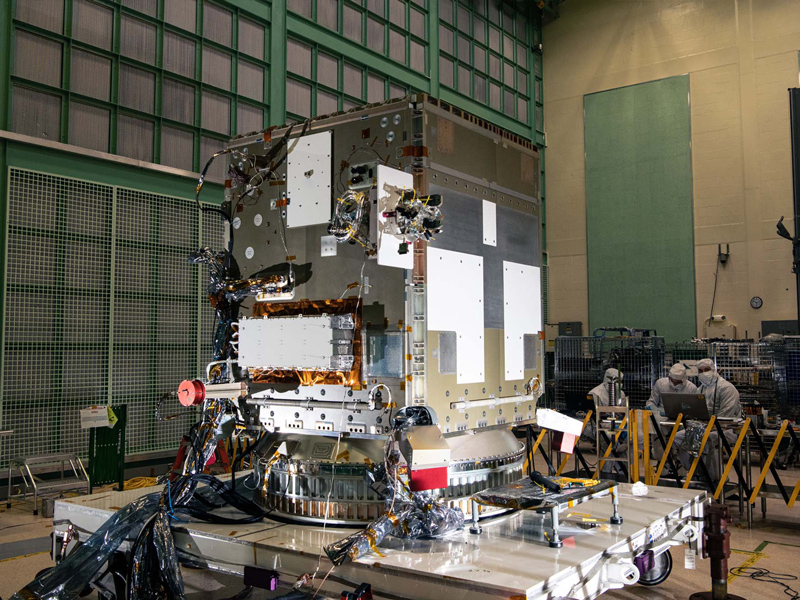 Testing solar array drive assembly on PACE spacecraft bus.