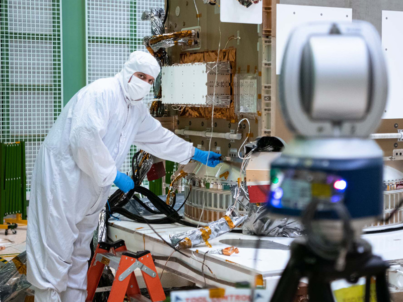 Alignment team working on the PACE spacecraft.