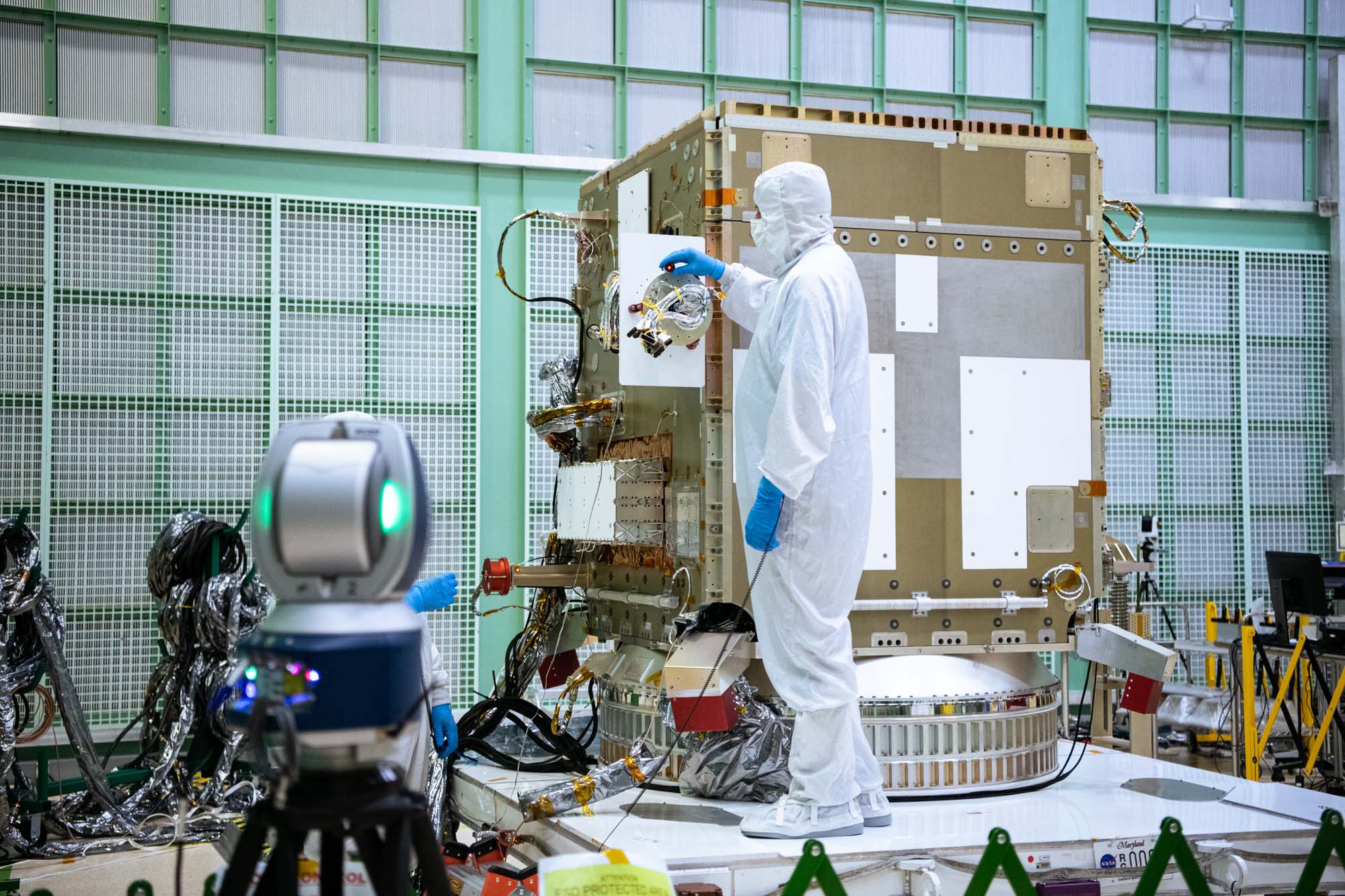 Alignment team working on the PACE spacecraft.