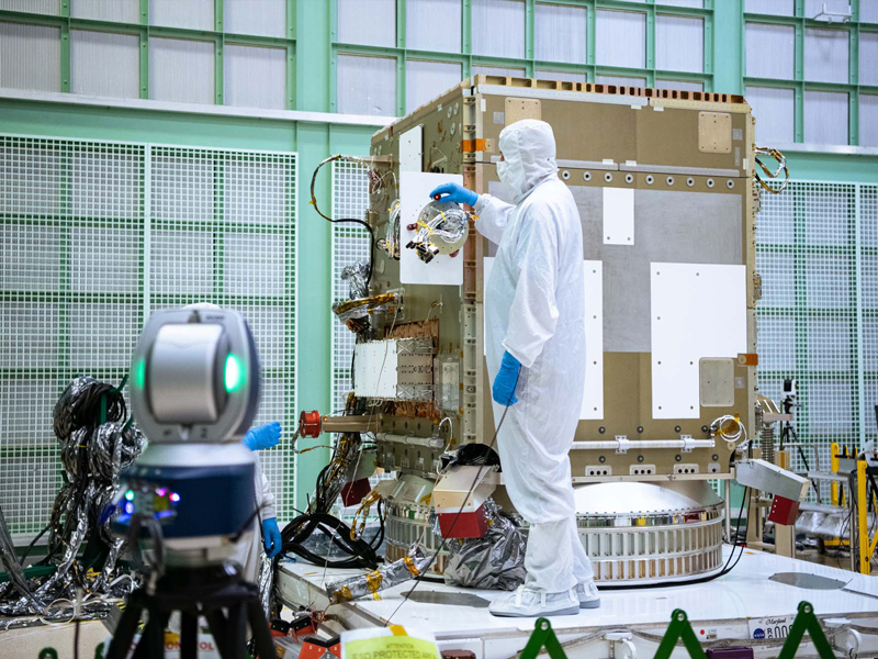 Alignment team working on the PACE spacecraft.