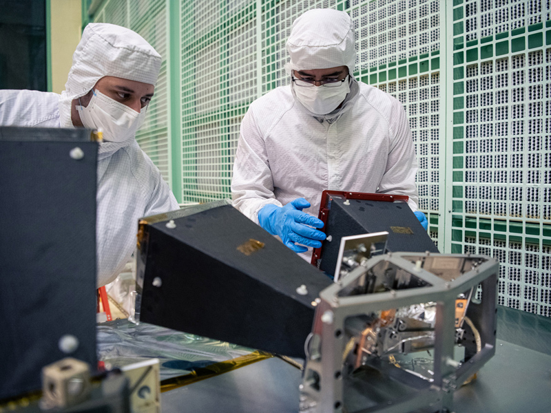 Inspecting the PACE Star Tracker Sensor.