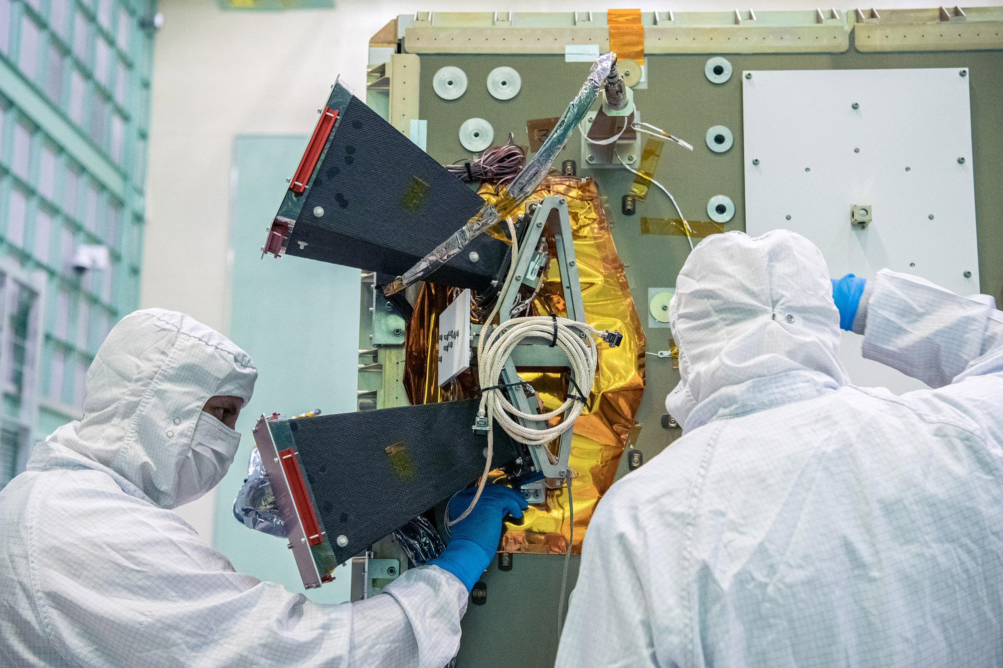 Installing the bus Star Tracker Sensor on the -Z Panel.