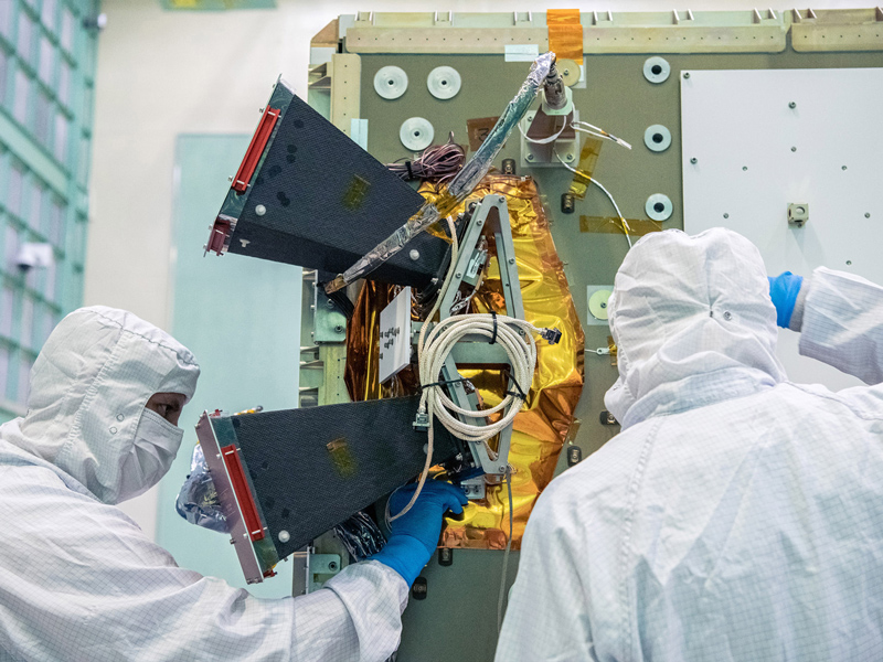 Installing the bus Star Tracker Sensor on the -Z Panel.