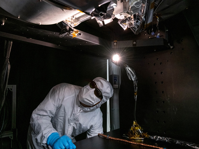 Manufacturing engineer, Roman Nilov, supervises the integration of the Short Wave Infrared (SWIR) Pulse Calibration Assembly (SPCA) fold mirror assembly to the Ocean Color Instrument. Credit: Mellos, Katherine