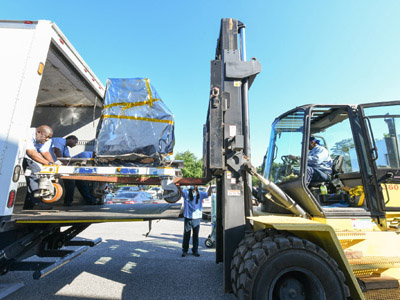 The GSFC Trax team lifts the Ocean Color Instrument on a forklift into a truck to transport to the integration and testing facility for envirnomental testing. Credit: Stover, Desiree