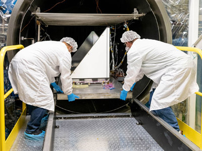 The Ocean Color Instrument Earth Shade (ES) is removed from a thermal chamber after successful testing.