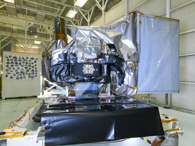 The Ocean Color Instrument (OCI) is prepared for environmental testing with installed thermal blankets and flight Earth Shade in a cleanroom at Goddard Space Flight Center. Credit: Stover, Desiree