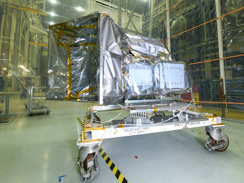 The Ocean Color Instrument is prepared for environmental testing with installed thermal blankets, protective contamination covers, and flight Earth Shade (ES). Credit: Stover, Desiree