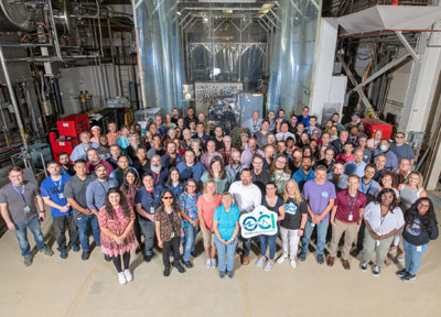 The Ocean Color Instrument (OCI) team poses with OCI and its integrated Earth Shade in June 2022 at Goddard Space Flight Center. Credit: Stover, Desiree
