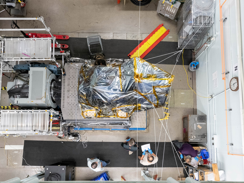 The Ocean Color Instrument is crane lifted onto the Y-axis vibration table. Credit: Mellos, Katherine