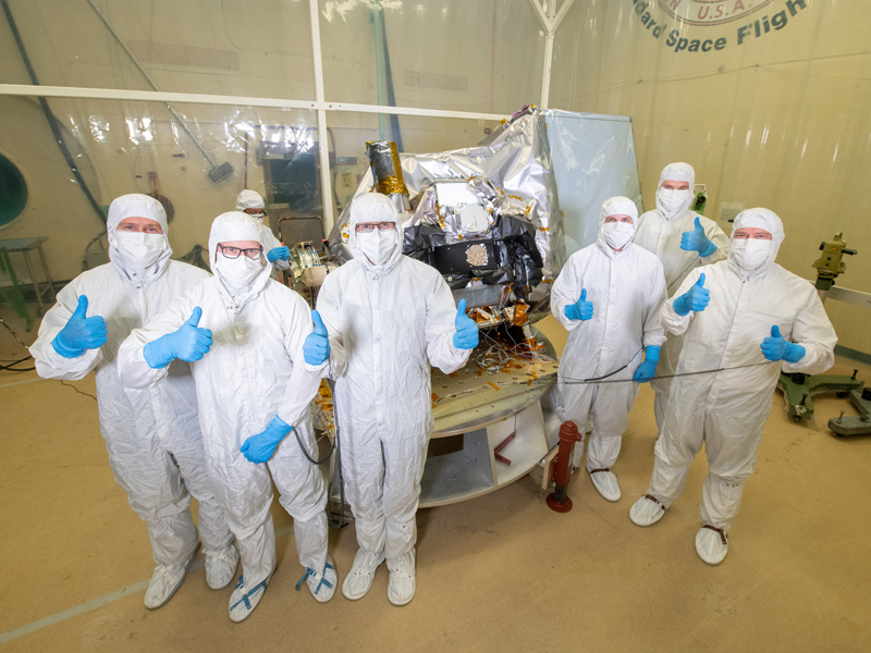 Ocean Color Instrument managers (Brian Clemons, Eric Gorman, Ulrik Gliese, Leland Chemerys, Joe Knuble, Robby Estep) pose with the instrument in the acoustic chamber. Credit: Stover, Desiree