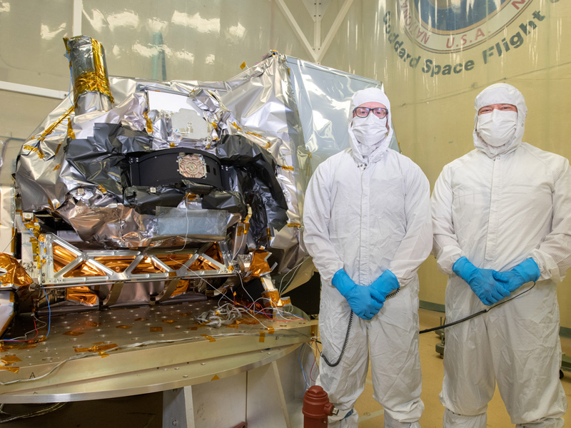 Eric Gorman & Robby Estep pose with the instrument and integrated earth shade and Tilt fixture in the acoustic chamber. Credit: Stover, Desiree