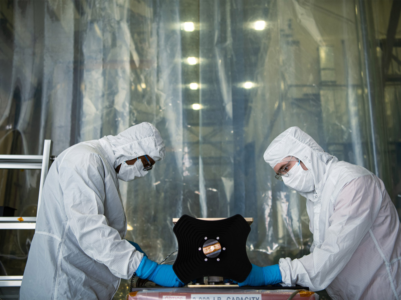 Installating HARP2 polarimeter on thermal vacuum plate. Credit: Henry, Dennis (Denny)