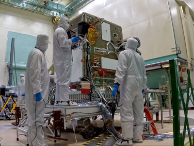 The red object is known as a "hat," which shields PACE’s Earth coverage antenna and prevents emission of radiation during testing.