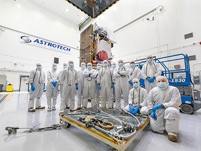 Mechanical Team Photo in front of PACE Observatory on Dolly at Astrotech during Launch Campaign. Credit: NASA