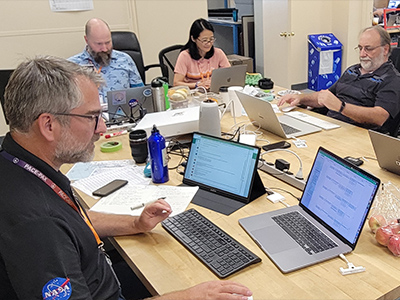 Operations planning at the NASA Armstrong Flight Research Center in Lancaster, CA. From L-R, Kirk Knobelspiesse (NASA GSFC), Sam LeBlanc (NASA Ames), Mijeong Park (UCAR), Tom Arnold (NASA GSFC), Kerry Meyer (NASA GSFC) prepare flight plans, weather forecasts and perform data analysis.