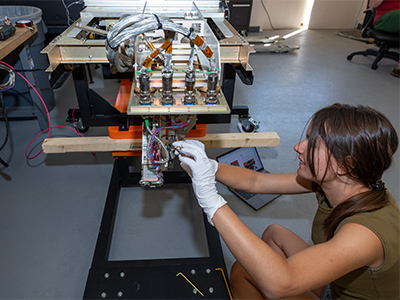 Brecht Simon (SRON) makes adjustments to the SPEX Airborne instrument, which flies in a pod on the NASA ER-2.