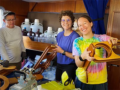 Joaquin Chaves Cedeno, Vanessa Strohm and Kelsey McBeain (NASA GSFC) assembling the wet lab onboard the R/V Shearwater.