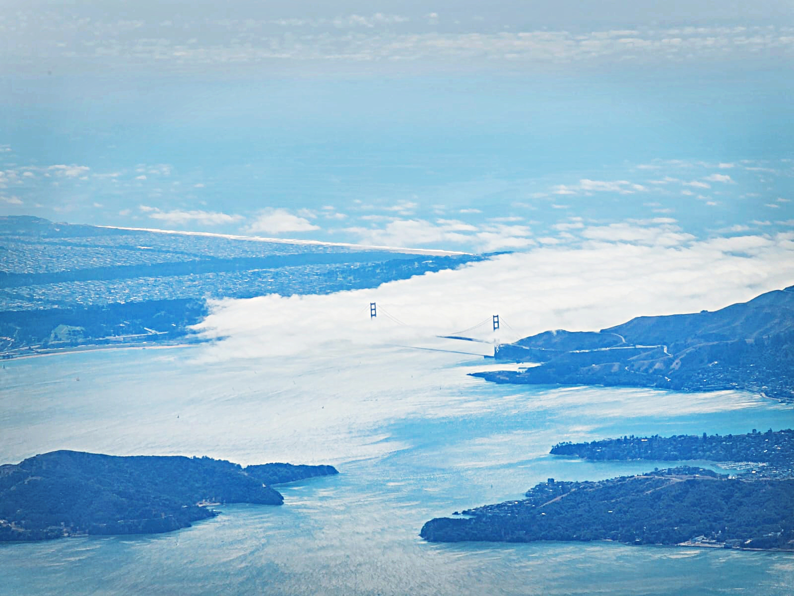 Fog and clouds with San Francisco and the Golden Gate Bridge taken from the Naval Postgraduate School (NPS) CIRPAS Twin Otter on September 12th, 2024.
