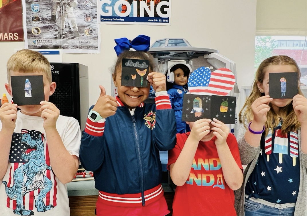 Students showing off their art